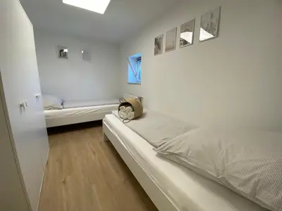 Ein Bett oder Betten in einem Zimmer der Unterkunft ☆FEWO ALTES KINO - MODERN - QUIET - 65M² - TV - NETFLIX - WLAN☆