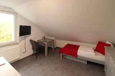 Ein Bett oder Betten in einem Zimmer der Unterkunft Boardinghouse - Alte Mühle