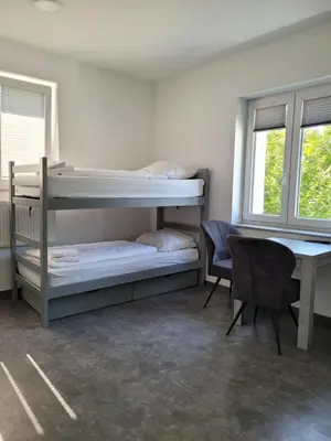 Ein Bett oder Betten in einem Zimmer der Unterkunft Boardinghouse - Alte Mühle