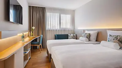 Ein Bett oder Betten in einem Zimmer der Unterkunft Hey Lou Hotel Karlsruhe Messe