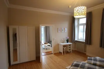 Ein Bett oder Betten in einem Zimmer der Unterkunft Ferienwohnung Altes Pfarrhaus Bargen