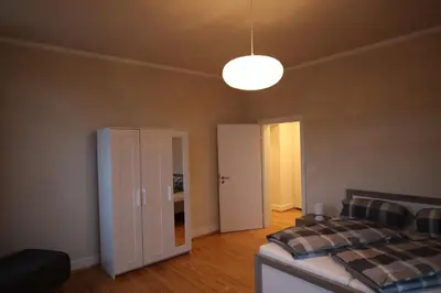 Ein Bett oder Betten in einem Zimmer der Unterkunft Ferienwohnung Altes Pfarrhaus Bargen