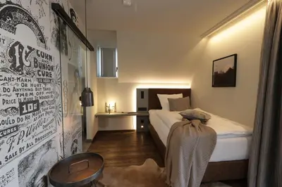 Ein Bett oder Betten in einem Zimmer der Unterkunft REINHARDTs HOTEL