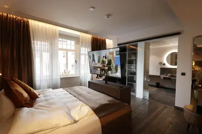 Ein Bett oder Betten in einem Zimmer der Unterkunft REINHARDTs HOTEL