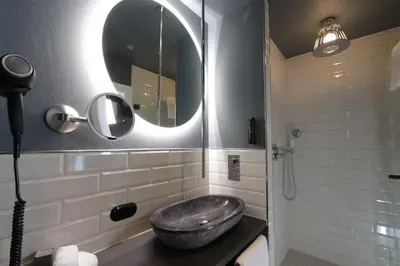 Ein Badezimmer in der Unterkunft REINHARDTs HOTEL