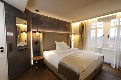 Ein Bett oder Betten in einem Zimmer der Unterkunft REINHARDTs HOTEL