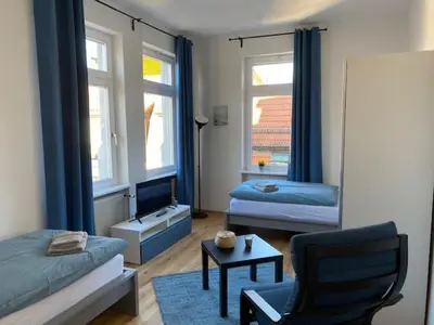 Ein Bett oder Betten in einem Zimmer der Unterkunft Gästehaus Windheim Ettlingen Stadt
