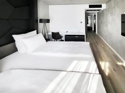 Ein Bett oder Betten in einem Zimmer der Unterkunft DORMERO Hotel Aschaffenburg