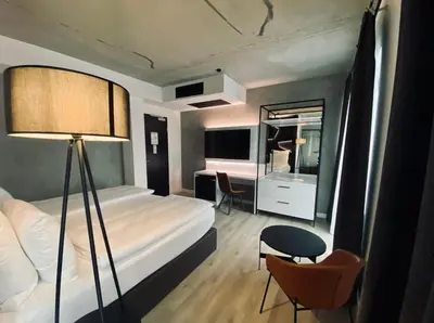 Ein Bett oder Betten in einem Zimmer der Unterkunft DORMERO Hotel Aschaffenburg