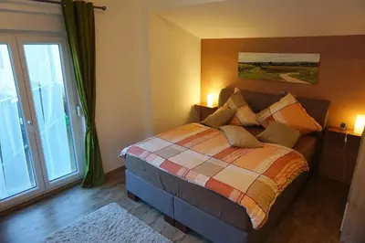 Ein Bett oder Betten in einem Zimmer der Unterkunft Ferienwohnung Familie Westermann