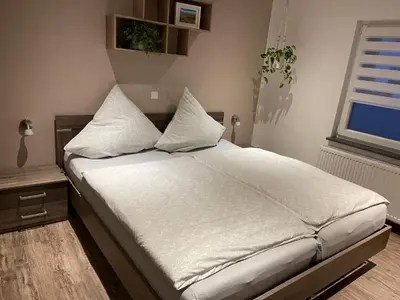 Ein Bett oder Betten in einem Zimmer der Unterkunft Ferienwohnung Jasmin