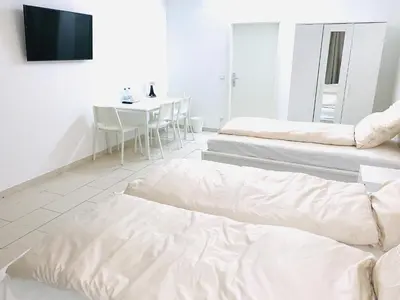 Ein Bett oder Betten in einem Zimmer der Unterkunft Zentrales Wohlfühl Apartment, 10 Min bis Frankfurt HBF