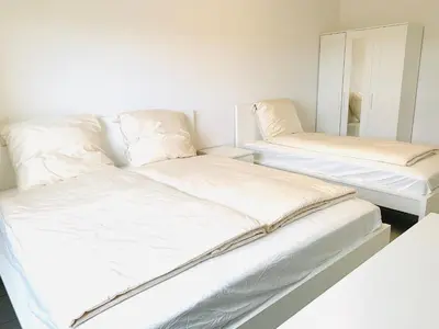 Ein Bett oder Betten in einem Zimmer der Unterkunft Zentrales Wohlfühl Apartment, 10 Min bis Frankfurt HBF