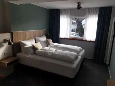 Ein Bett oder Betten in einem Zimmer der Unterkunft Hotel Brasserie Chaussee