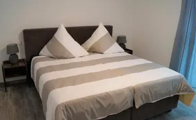 Ein Bett oder Betten in einem Zimmer der Unterkunft Flat11 4-Zi Wohnung Messe Karlsruhe