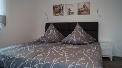 Ein Bett oder Betten in einem Zimmer der Unterkunft Flat11 4-Zi Wohnung Messe Karlsruhe