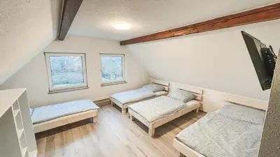 Ein Bett oder Betten in einem Zimmer der Unterkunft Mulinhouse Lingenfeld