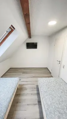 Ein Bett oder Betten in einem Zimmer der Unterkunft Mulinhouse Lingenfeld