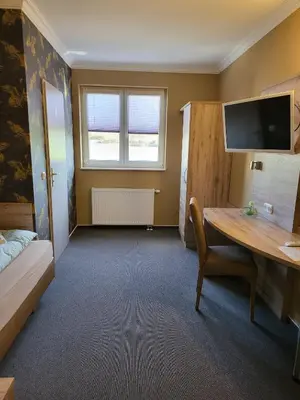 Ein Bett oder Betten in einem Zimmer der Unterkunft Appart Hotel Roßdorf