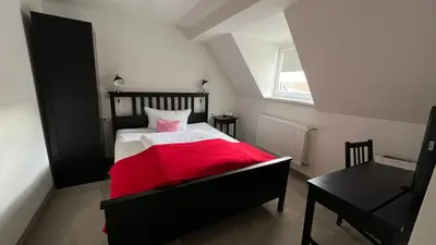 Ein Bett oder Betten in einem Zimmer der Unterkunft Hotel & Restaurant Zum Karpfen