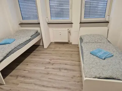 Ein Bett oder Betten in einem Zimmer der Unterkunft Monteurwohnung Mühlacker - L8 Street