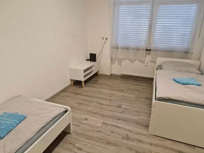 Ein Bett oder Betten in einem Zimmer der Unterkunft Monteurwohnung Mühlacker - L8 Street