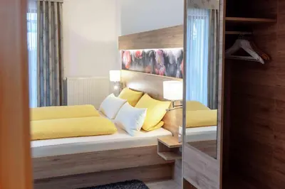 Ein Bett oder Betten in einem Zimmer der Unterkunft Gästehaus am Fürstweg