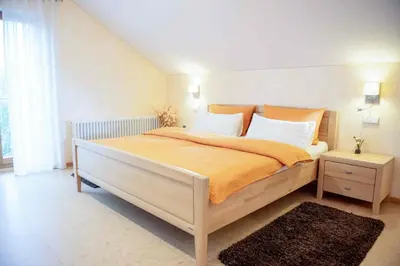 Ein Bett oder Betten in einem Zimmer der Unterkunft Gästehaus am Fürstweg