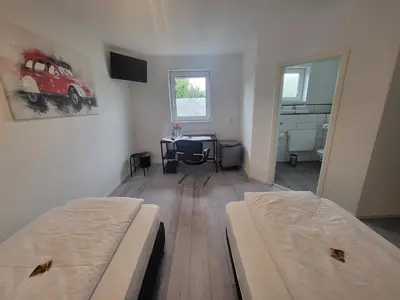 Ein Bett oder Betten in einem Zimmer der Unterkunft Zimmerwelt-Ilsfeld