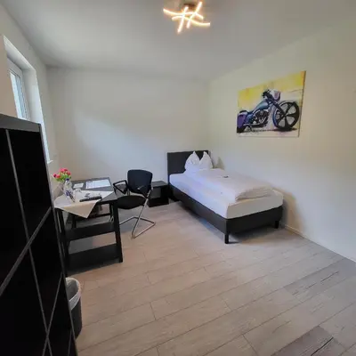 Ein Bett oder Betten in einem Zimmer der Unterkunft Zimmerwelt-Ilsfeld
