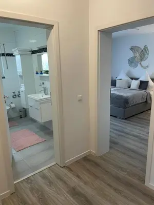 Ein Bett oder Betten in einem Zimmer der Unterkunft Prime Host Lovely Apartment