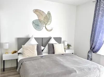 Ein Bett oder Betten in einem Zimmer der Unterkunft Prime Host Style Apartment