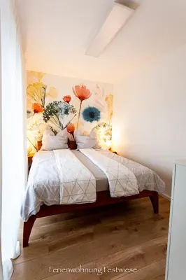 Ein Bett oder Betten in einem Zimmer der Unterkunft FESTWIESE - modernes Apartment nahe Neustadter Innenstadt