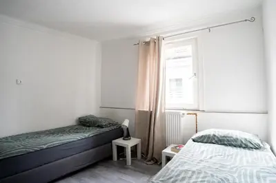 Ein Bett oder Betten in einem Zimmer der Unterkunft KiRoom Willsbach 2 und 3
