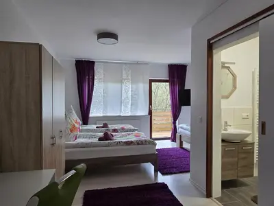 Ein Bett oder Betten in einem Zimmer der Unterkunft La Casa Suciu