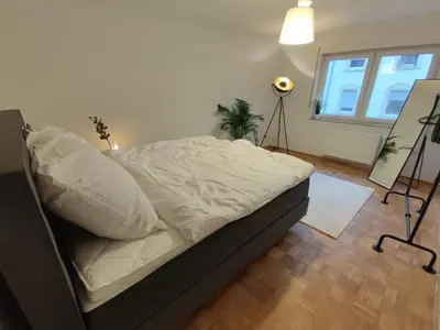 Ein Bett oder Betten in einem Zimmer der Unterkunft ZEN Apartments - Exklusive Suite - Luxus - Boxspringbett