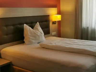 Ein Bett oder Betten in einem Zimmer der Unterkunft Pension die kleine Träumerei