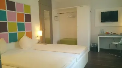 Ein Bett oder Betten in einem Zimmer der Unterkunft Altstadt Hotel Baunachshof