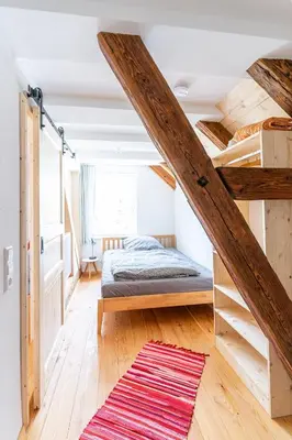 Ein Bett oder Betten in einem Zimmer der Unterkunft Gästehaus Großhöchberg