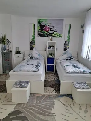Ein Bett oder Betten in einem Zimmer der Unterkunft Ferienwohnung Galina 1