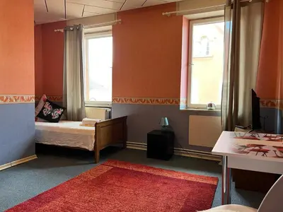 Ein Bett oder Betten in einem Zimmer der Unterkunft Ferienappartements Dolgesheim 2