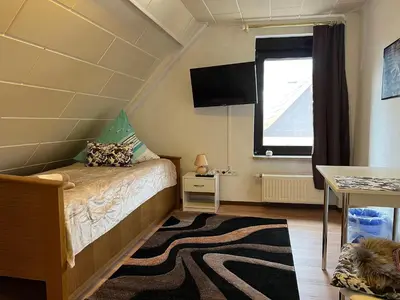 Ein Bett oder Betten in einem Zimmer der Unterkunft Ferienappartements Dolgesheim 4