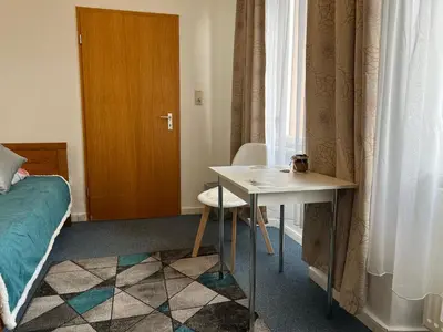 Ein Sitzbereich in der Unterkunft Ferienappartements Dolgesheim 5