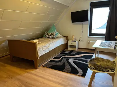 Ein Bett oder Betten in einem Zimmer der Unterkunft Ferienappartements Dolgesheim 5