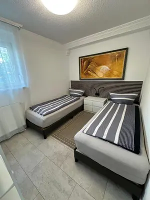 Ein Bett oder Betten in einem Zimmer der Unterkunft Ruhige geräumige Wohnung