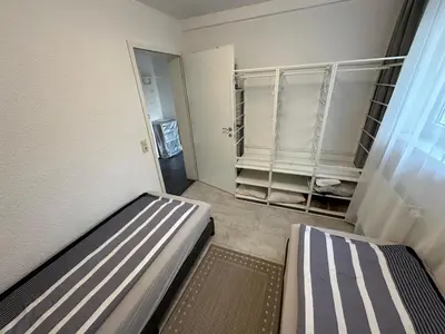 Ein Bett oder Betten in einem Zimmer der Unterkunft Ruhige geräumige Wohnung