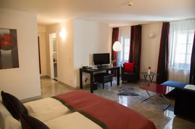 Ein Bett oder Betten in einem Zimmer der Unterkunft TRIP INN Kaiser Hotel & Restaurant Heidelberg-Schriesheim