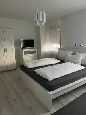 Ein Bett oder Betten in einem Zimmer der Unterkunft Gästehaus Elisabeth