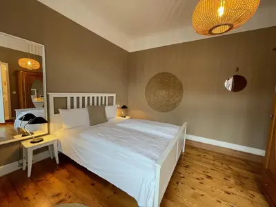 Ein Bett oder Betten in einem Zimmer der Unterkunft AUERSTEIN-Hotels auerstein & auerstein-mono