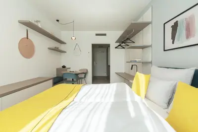 Ein Bett oder Betten in einem Zimmer der Unterkunft Candlewood Suites Heidelberg by IHG